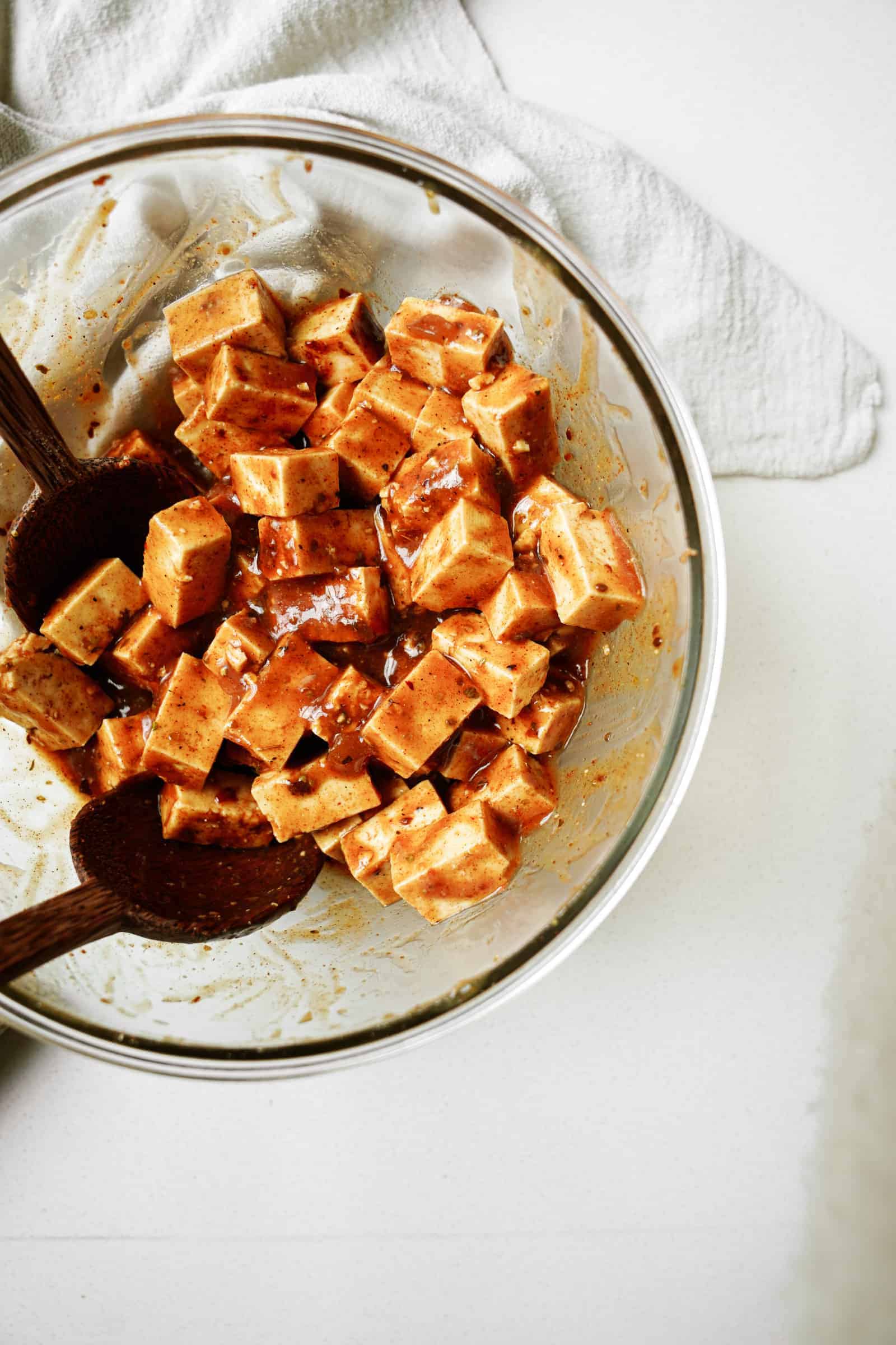 Tofu in bowl being marinated for Marinated Tofu and Vegetable Skewers