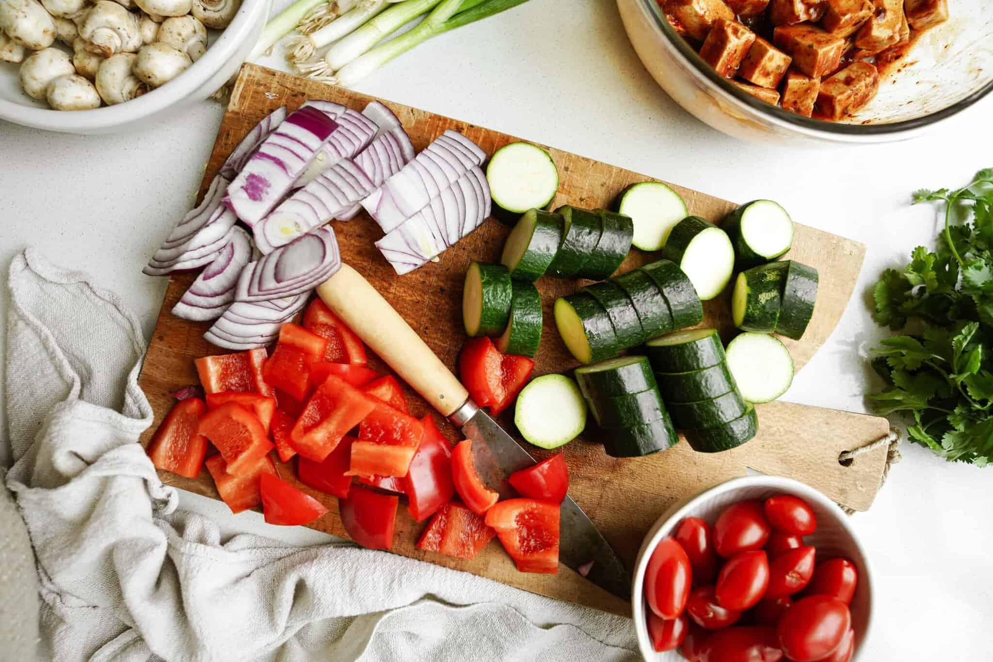 Raw vegetables prepped to be put on skewers