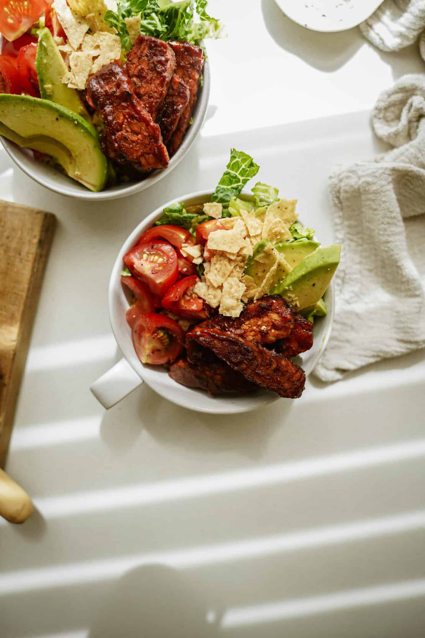 BBQ tempeh bowl with fresh veggies in a bowl