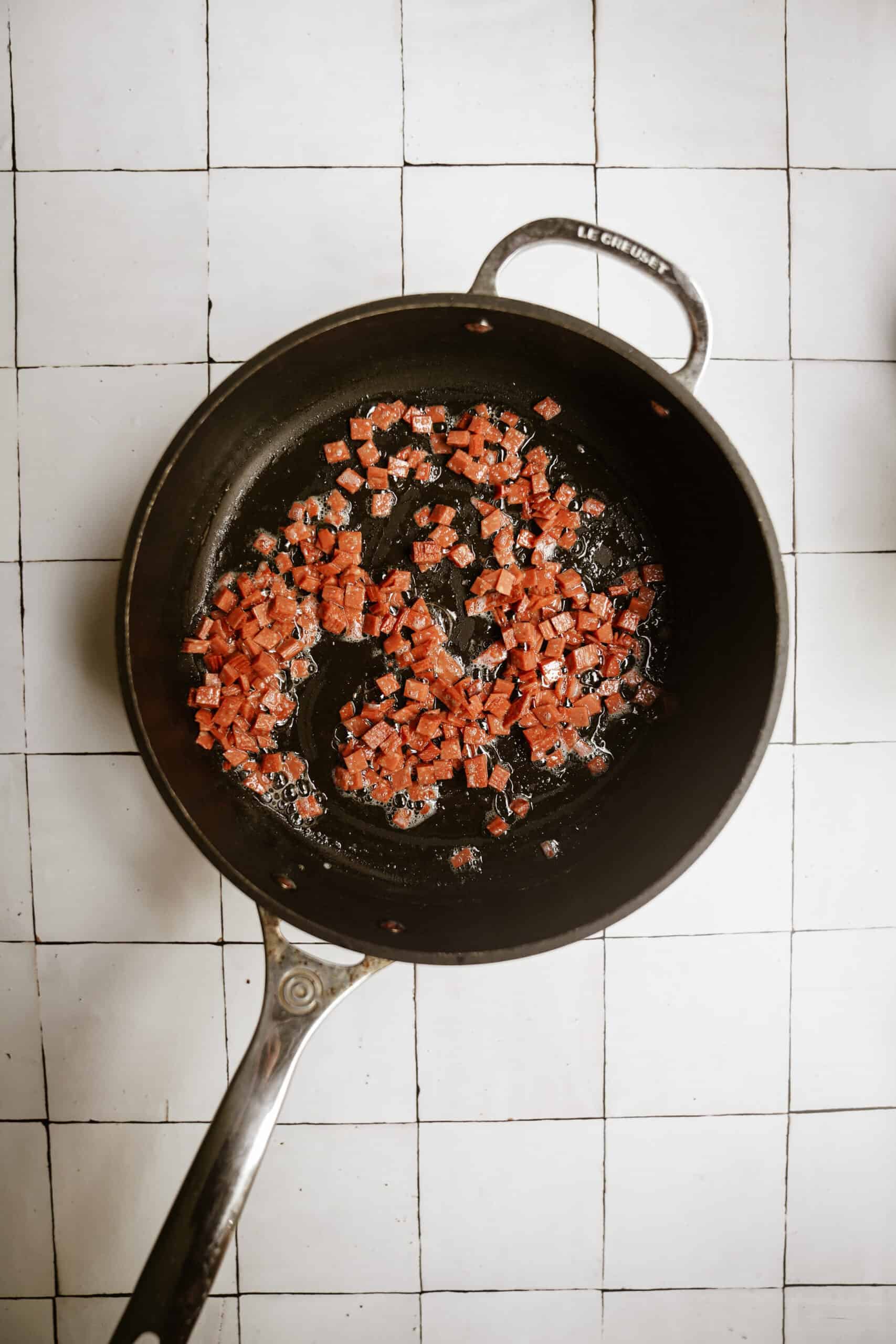 Vegan bacon cooking in a pan