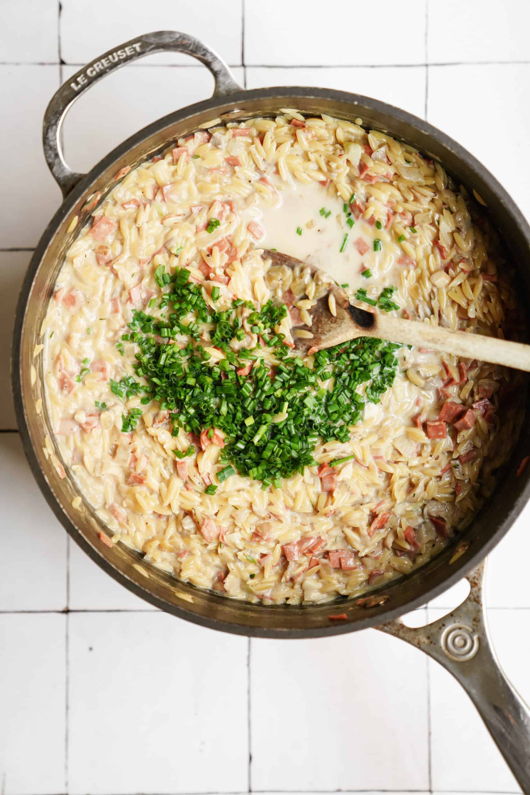 Chives added onto of orzo carbonara 