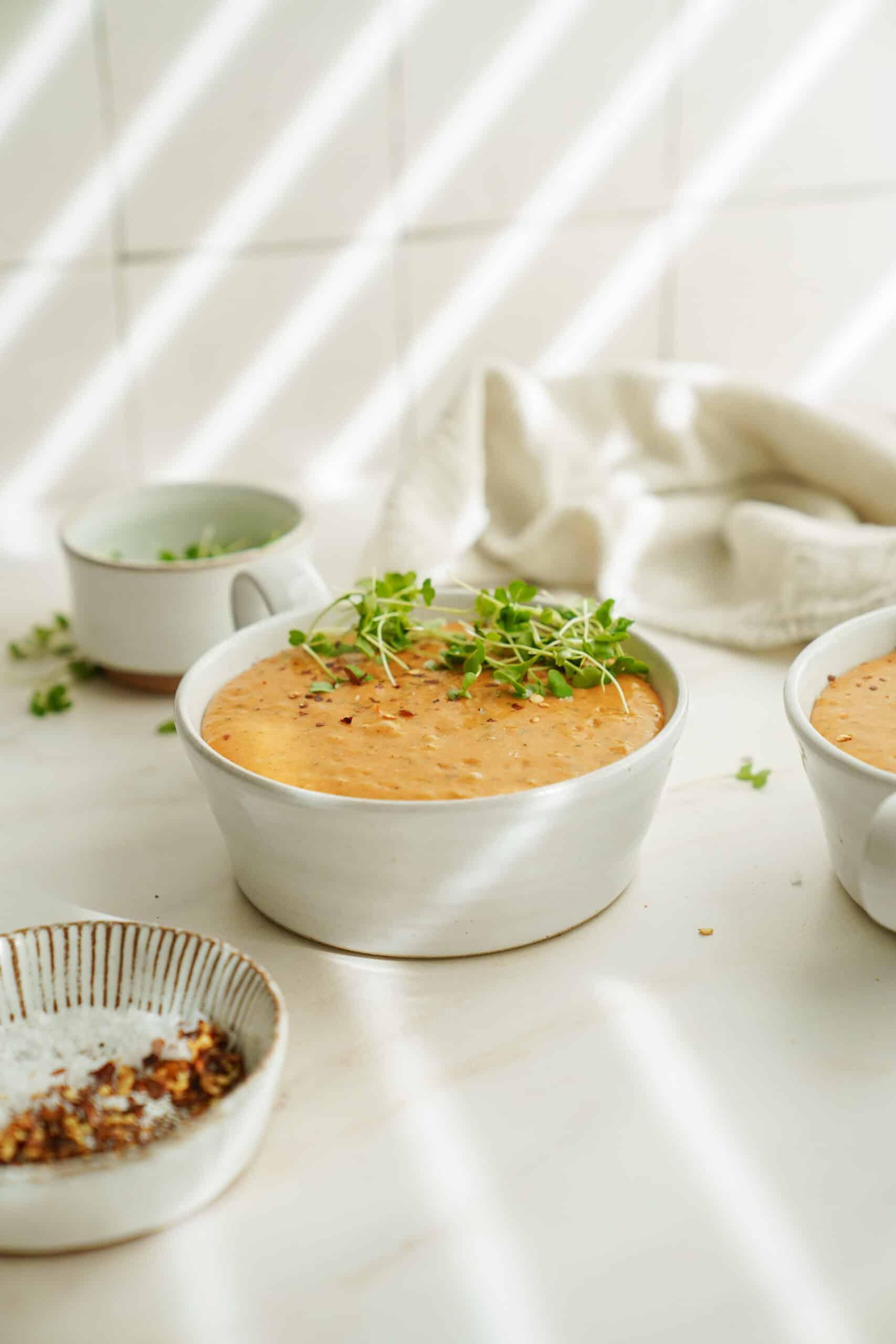 Creamy tomato soup in a white bowl