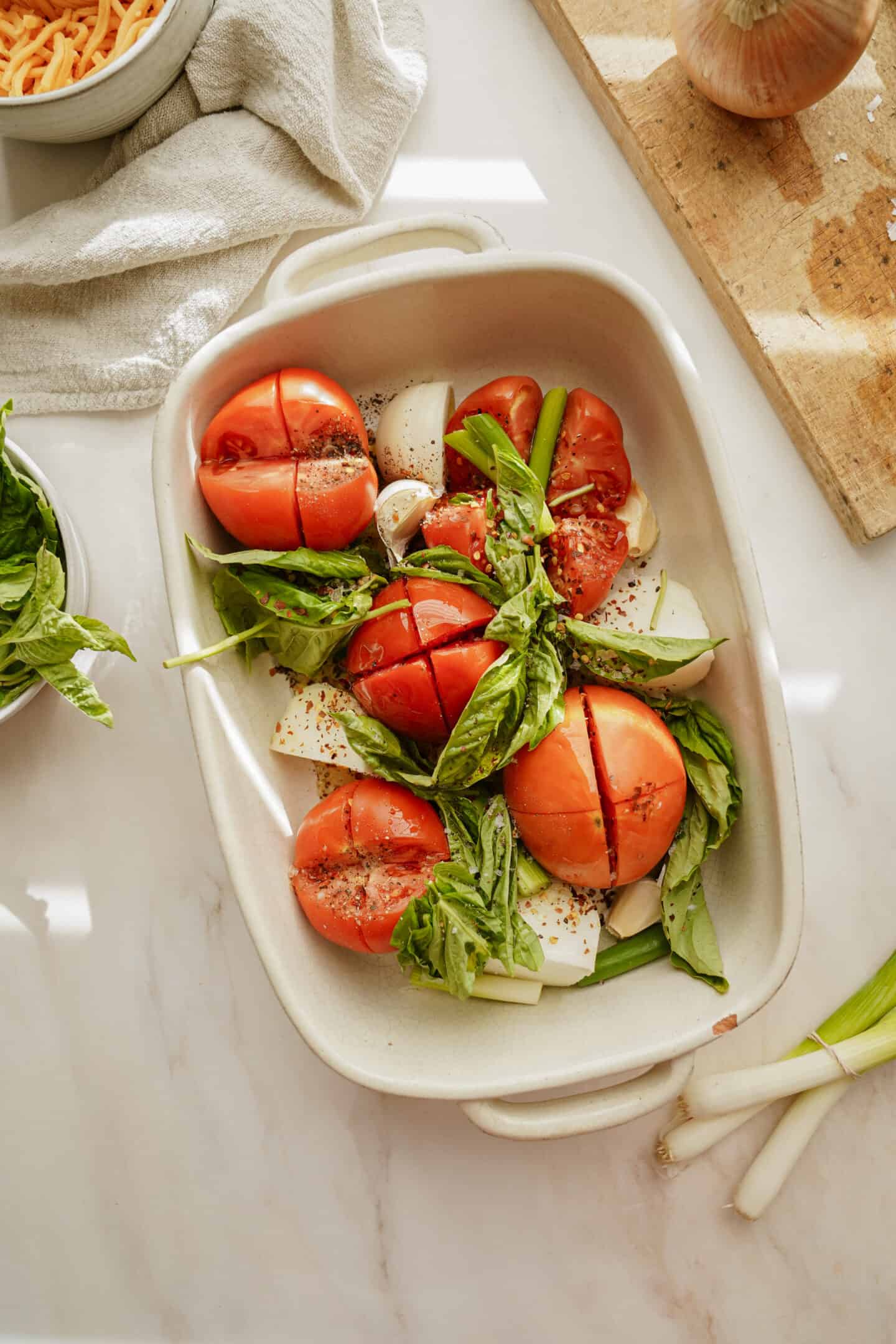 Fresh ingredients for vegan tomato soup in a casserole dish