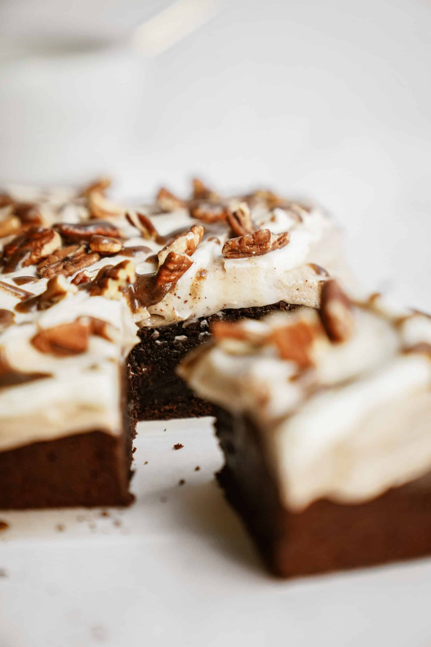 Fudge brownies on a counter with a slice out of it