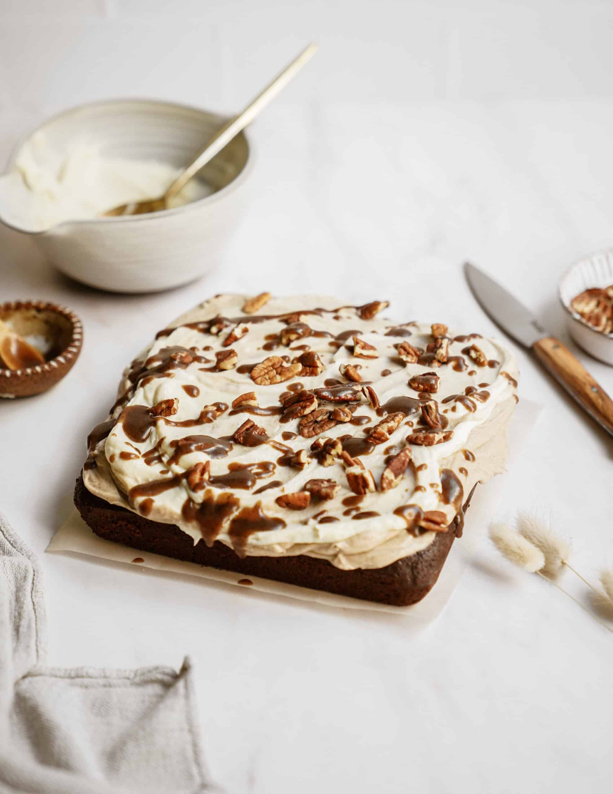 Fudge brownies with icing on countertop