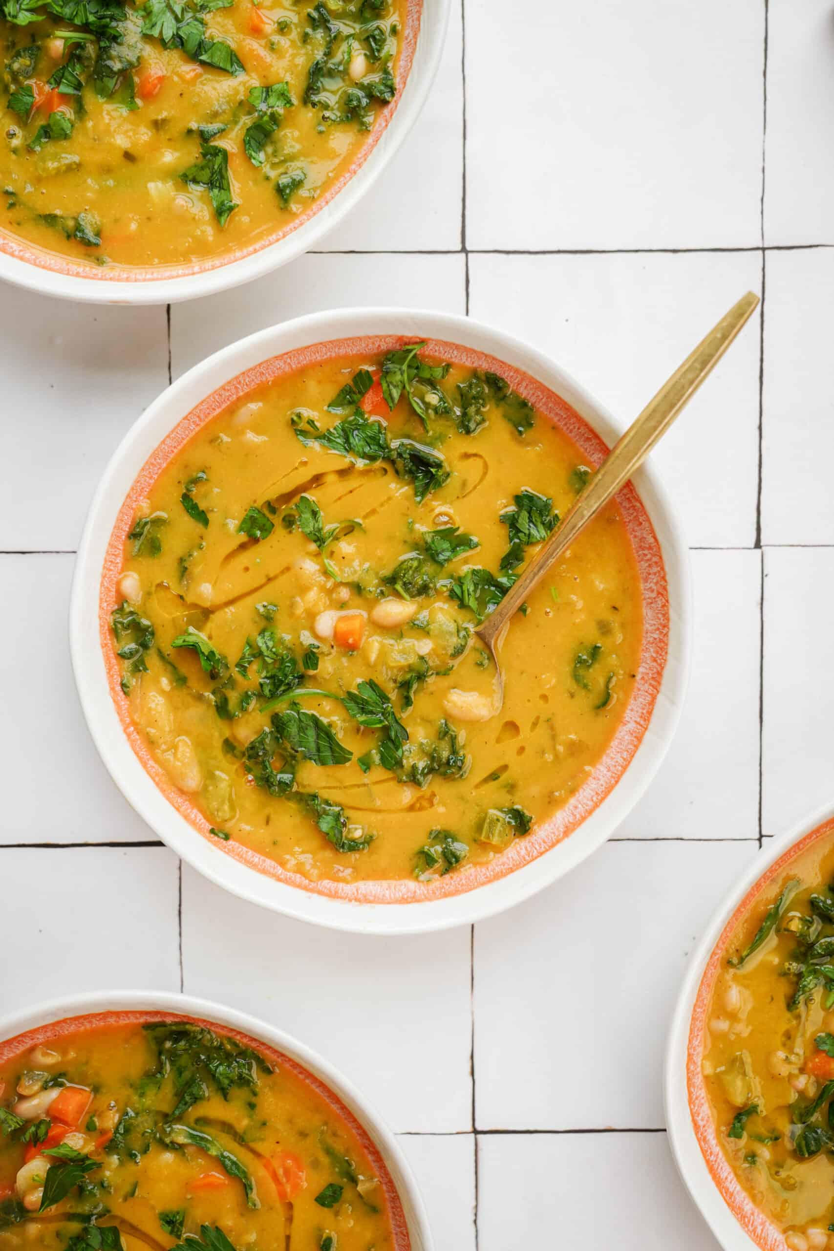 White bean soup in a white bowl