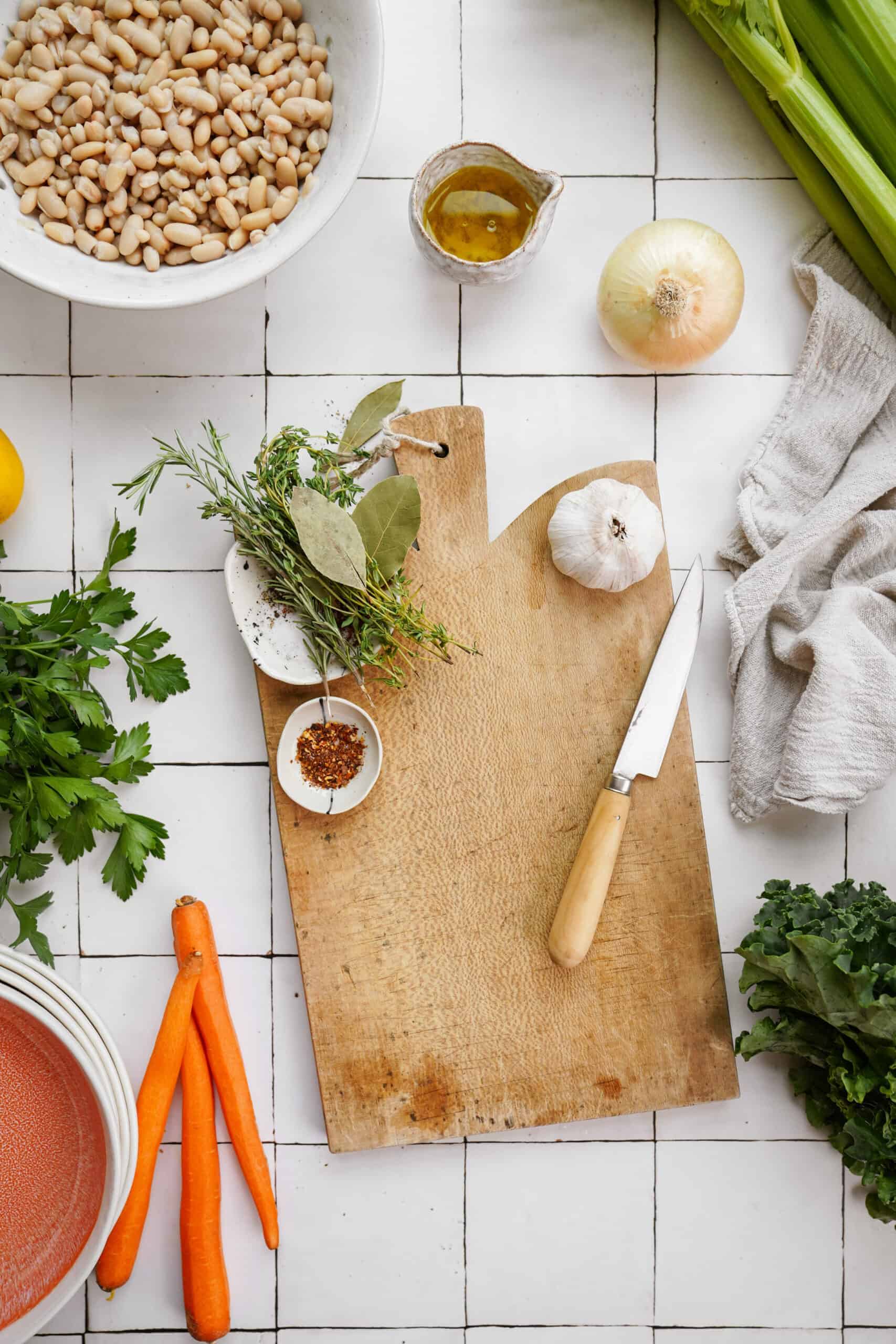 Ingredients for white bean soup on a counter