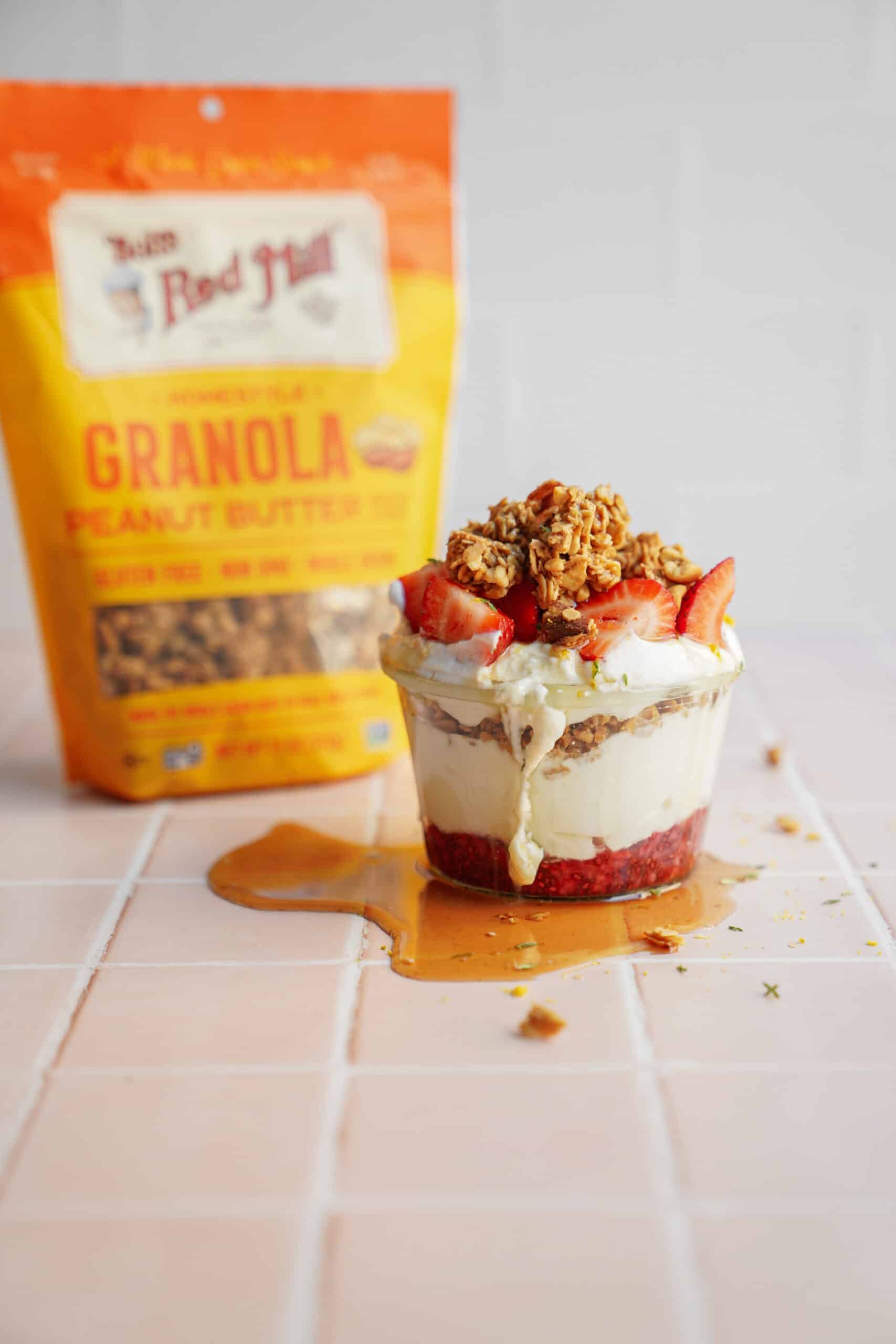 Bag of granola next to a Yogurt Parfait 