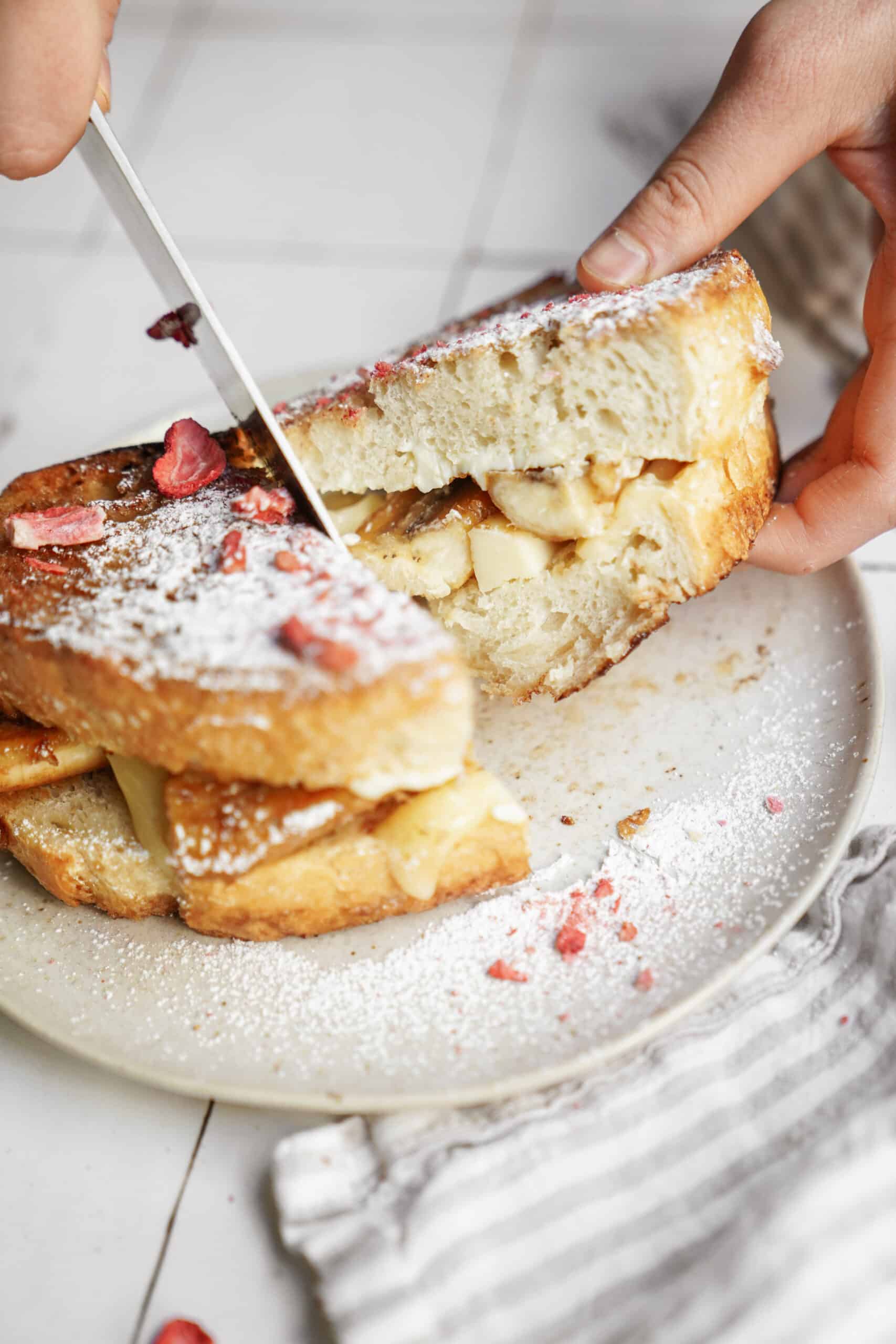 Bananas foster recipe in a grilled cheese form on a white plate