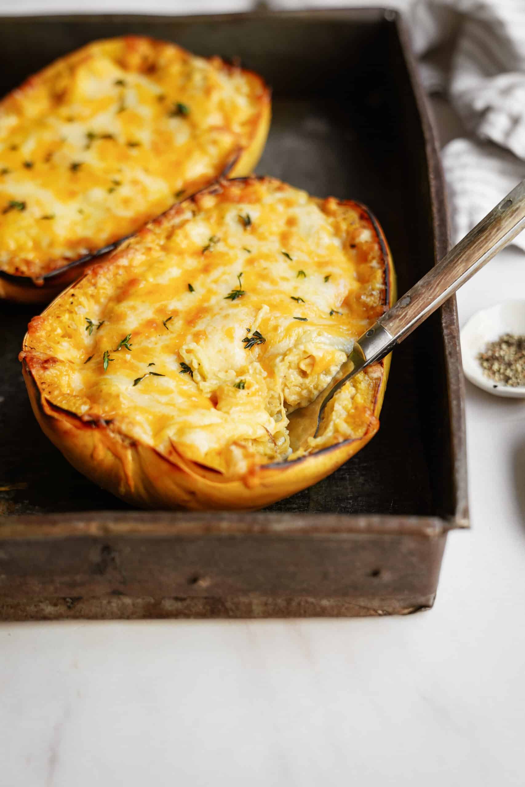 Stuffed spaghetti squash with cheese on top 