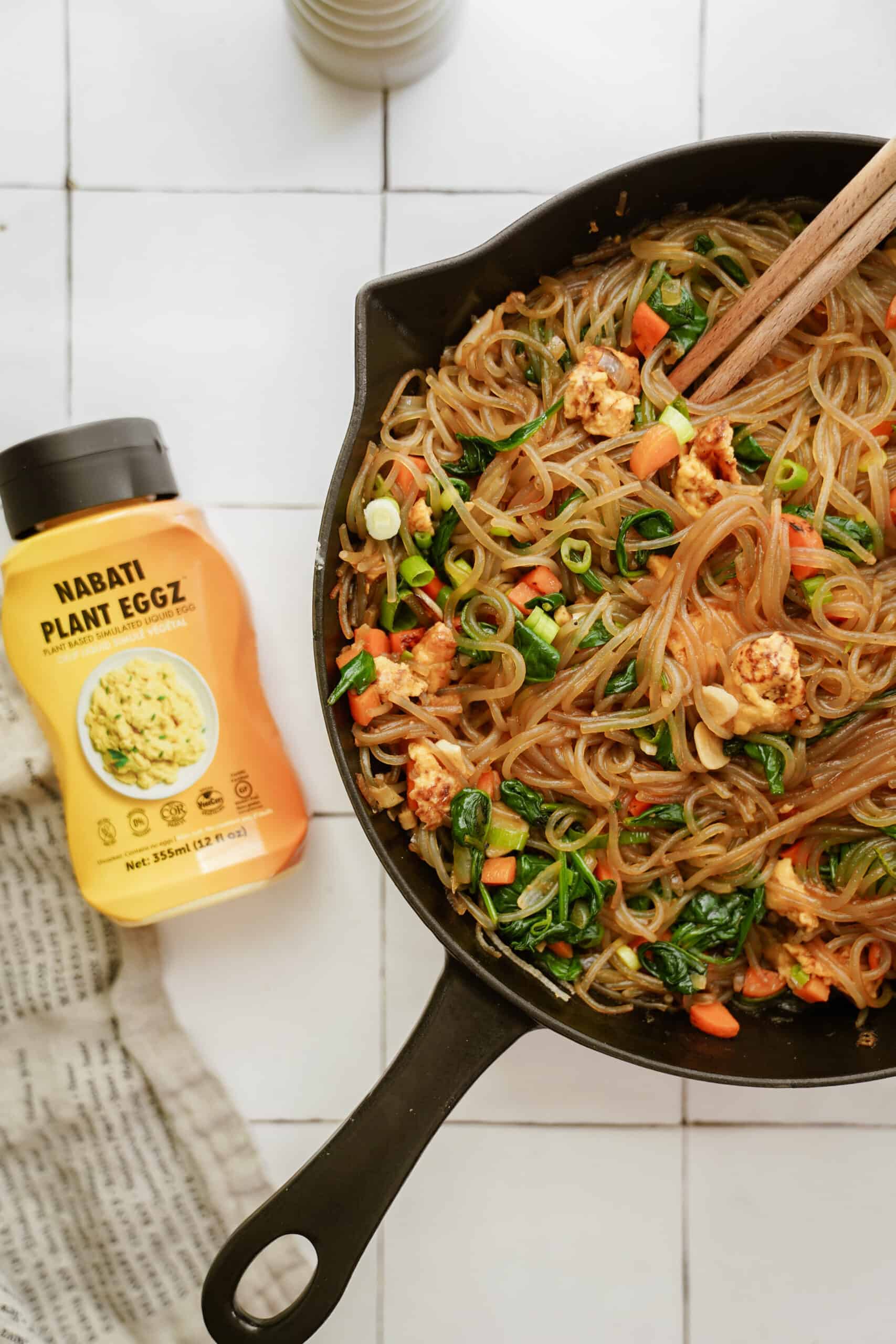 Vegan Japchae in a cast iron pot on counter