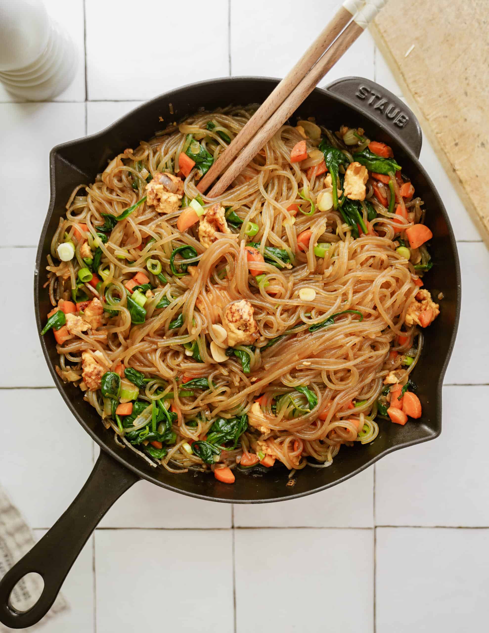 Vegan Japchae in a cast iron pot on counter