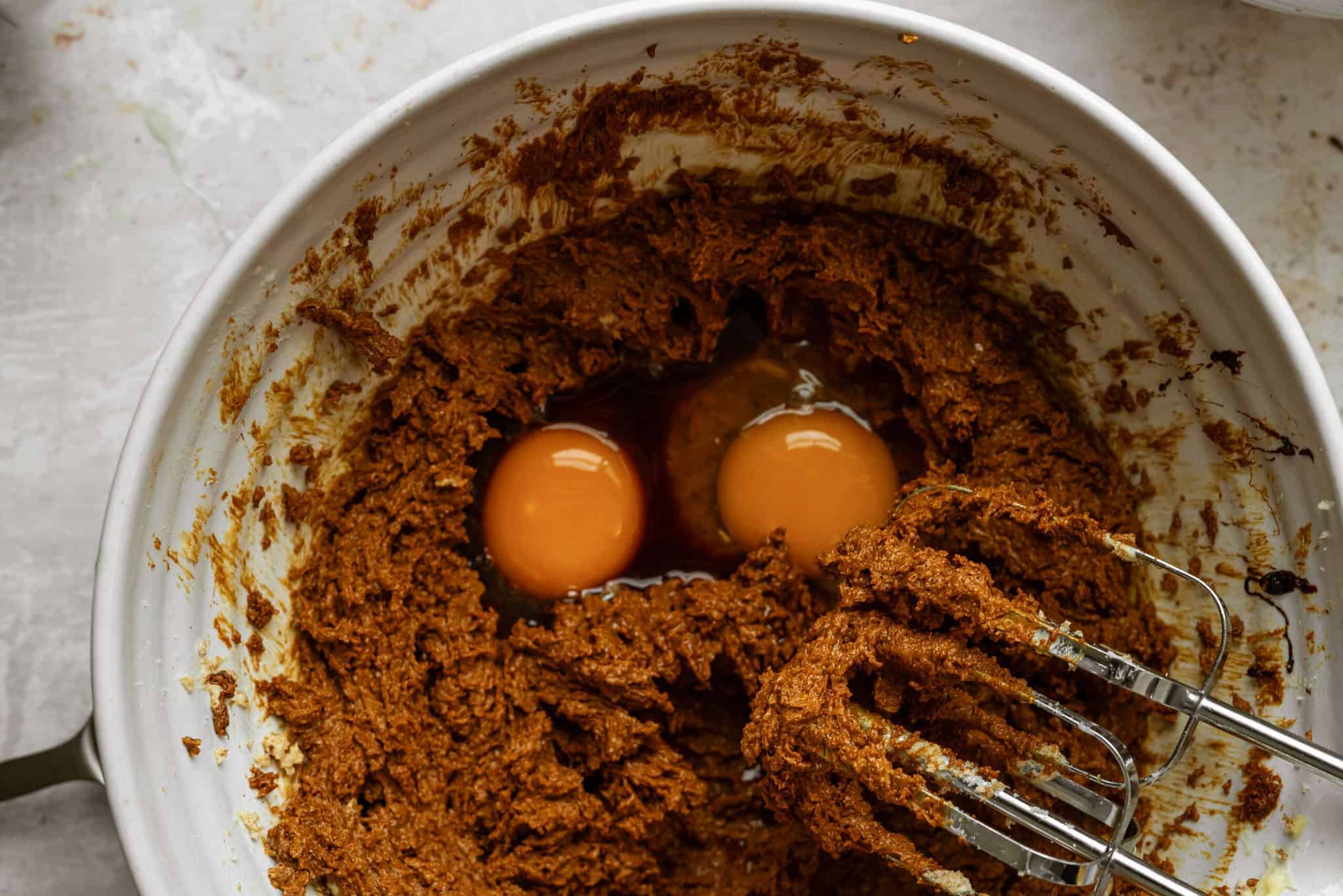 Ingredients for Ginger Snap Crinkle Cookies in a mixing bowl