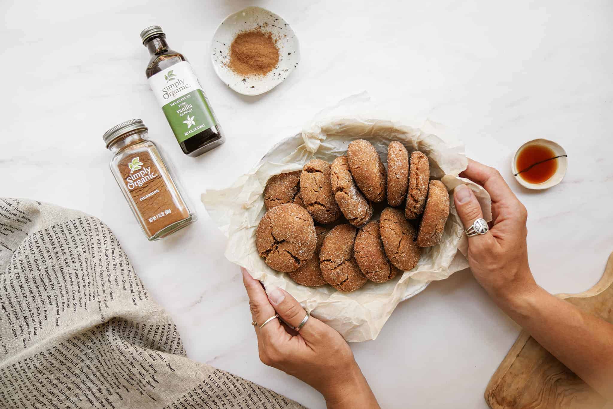 Ginger Snap Crinkle Cookies in a basket next to spices