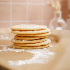 Stack of holiday sugar cookies on a surface