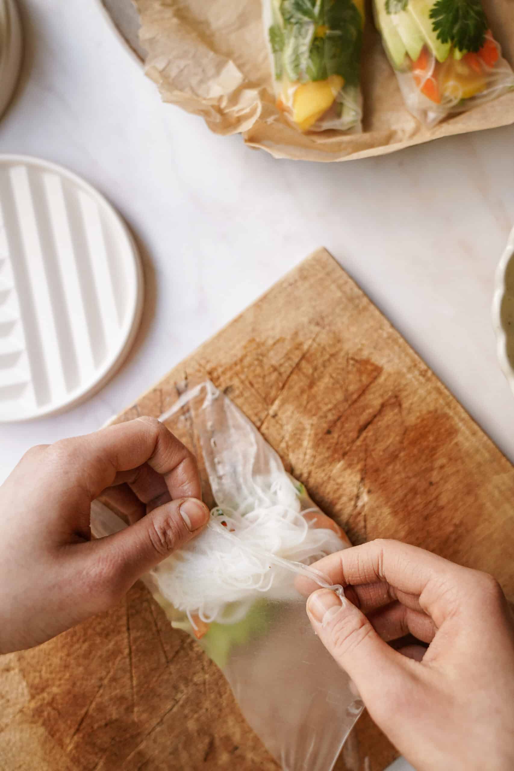 Folding rice paper on cutting board