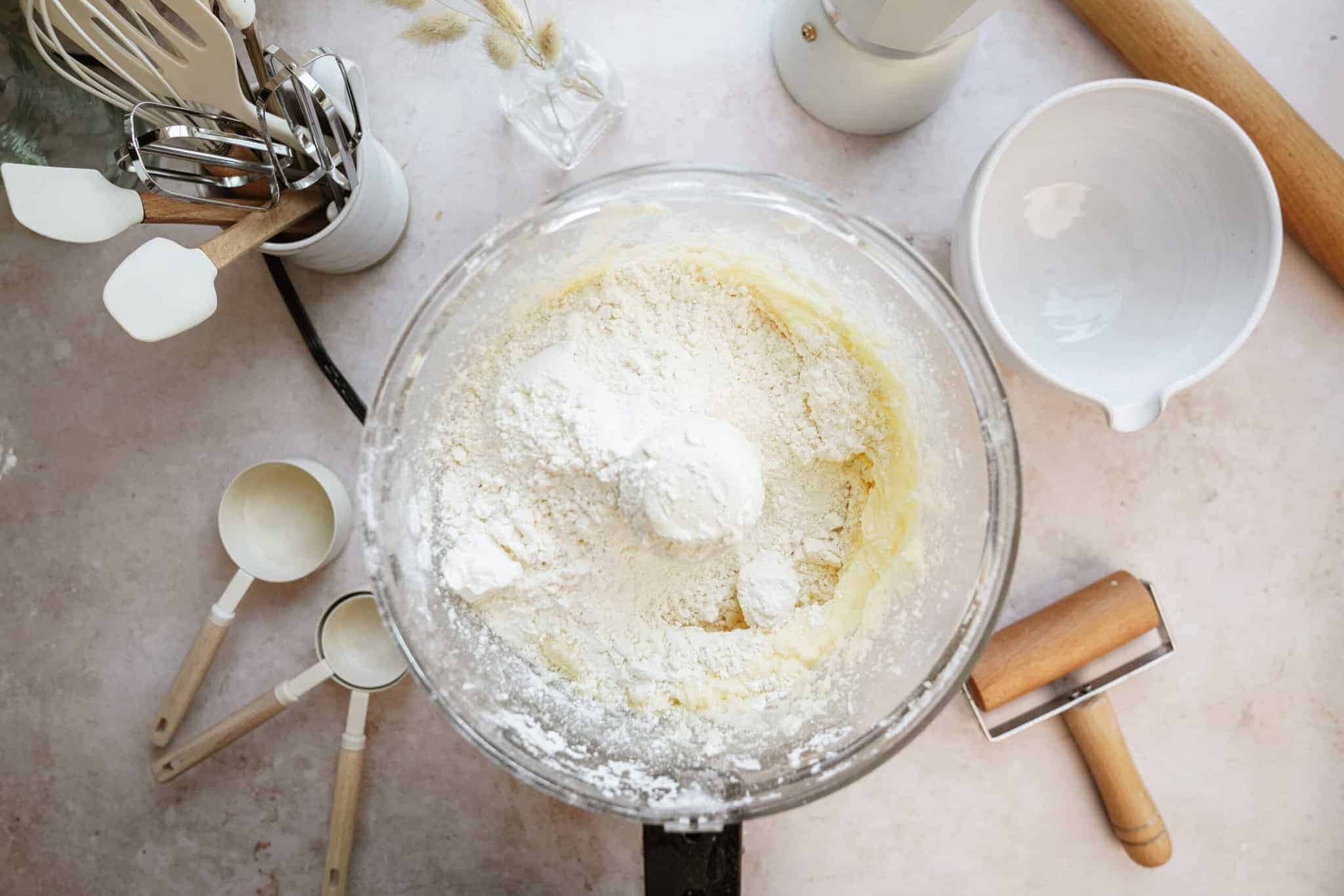 Ingredients for Holiday Shortbread Bites in a mixer