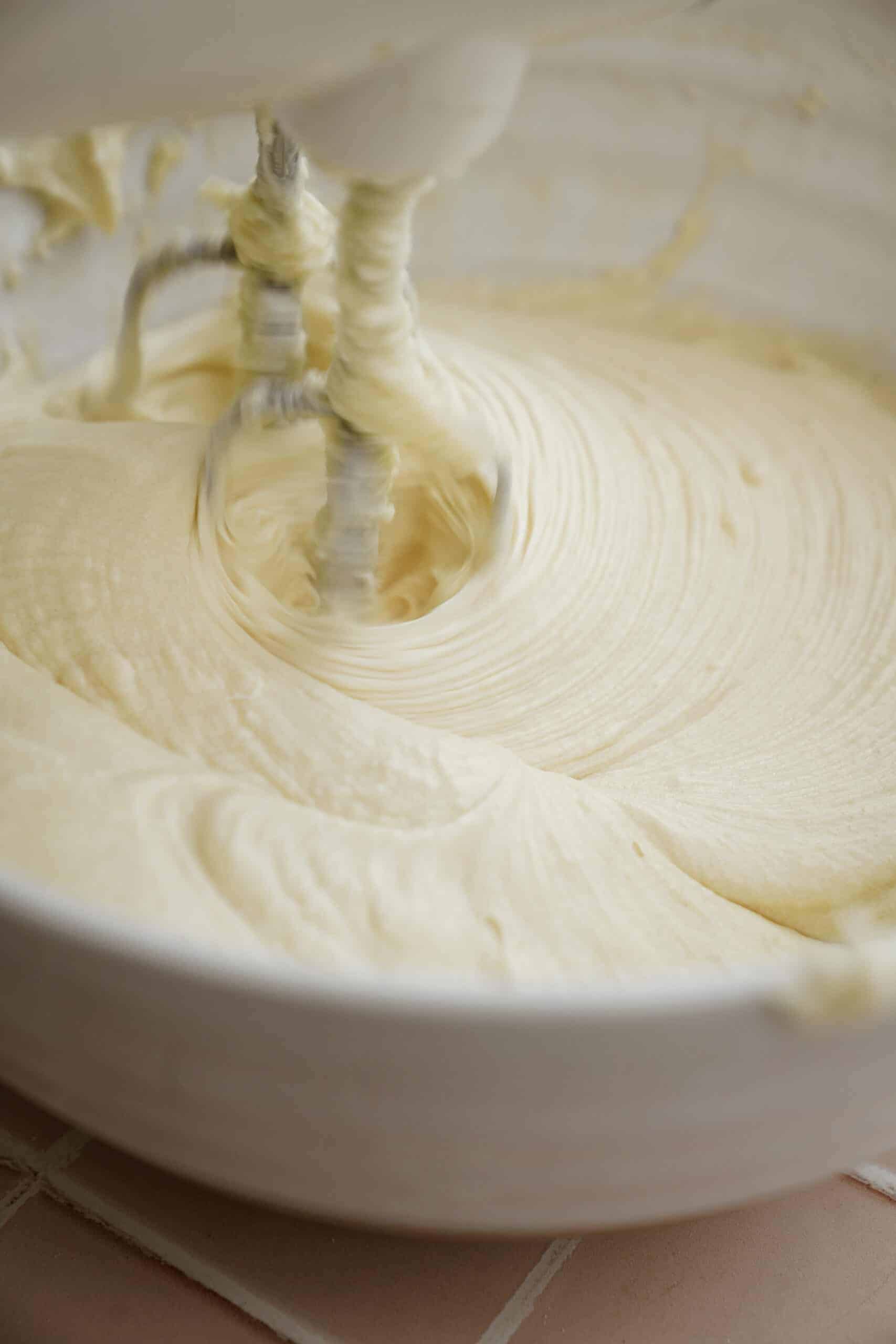 Ingredients for vanilla cake being beaten with a mixer