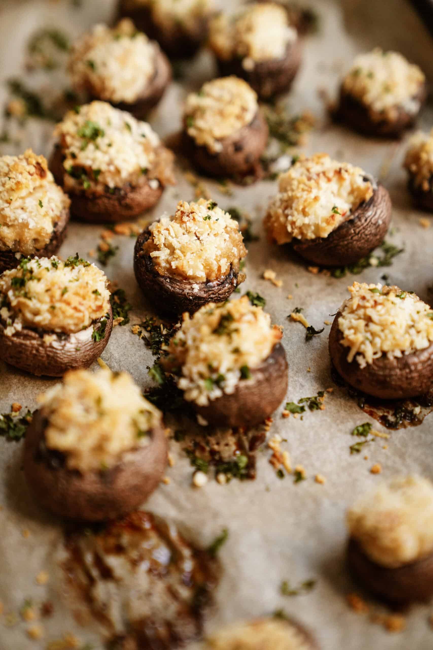 Vegetarian stuffed mushrooms on a baking tray