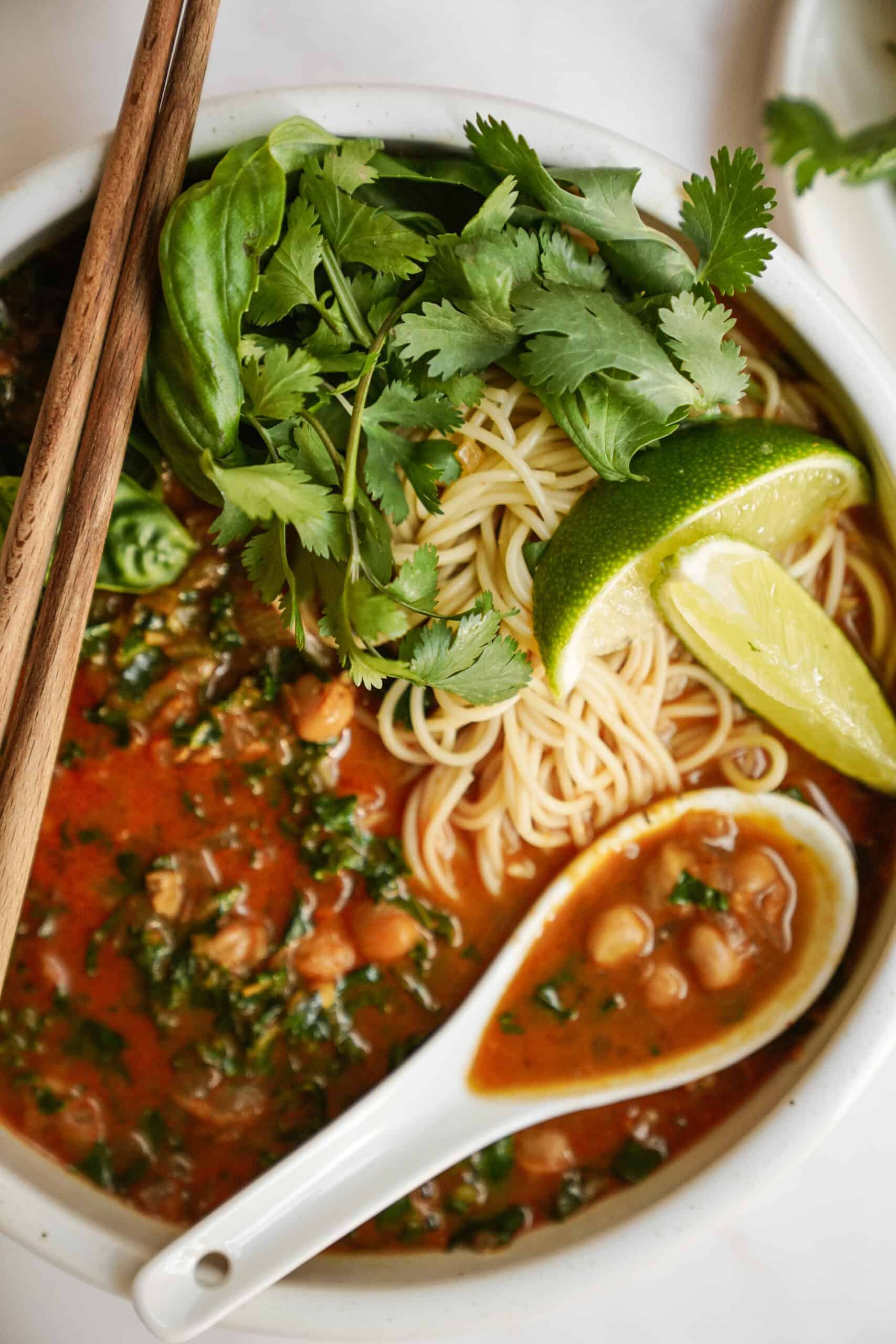 Curry noodle soup in big bowl with chopsticks