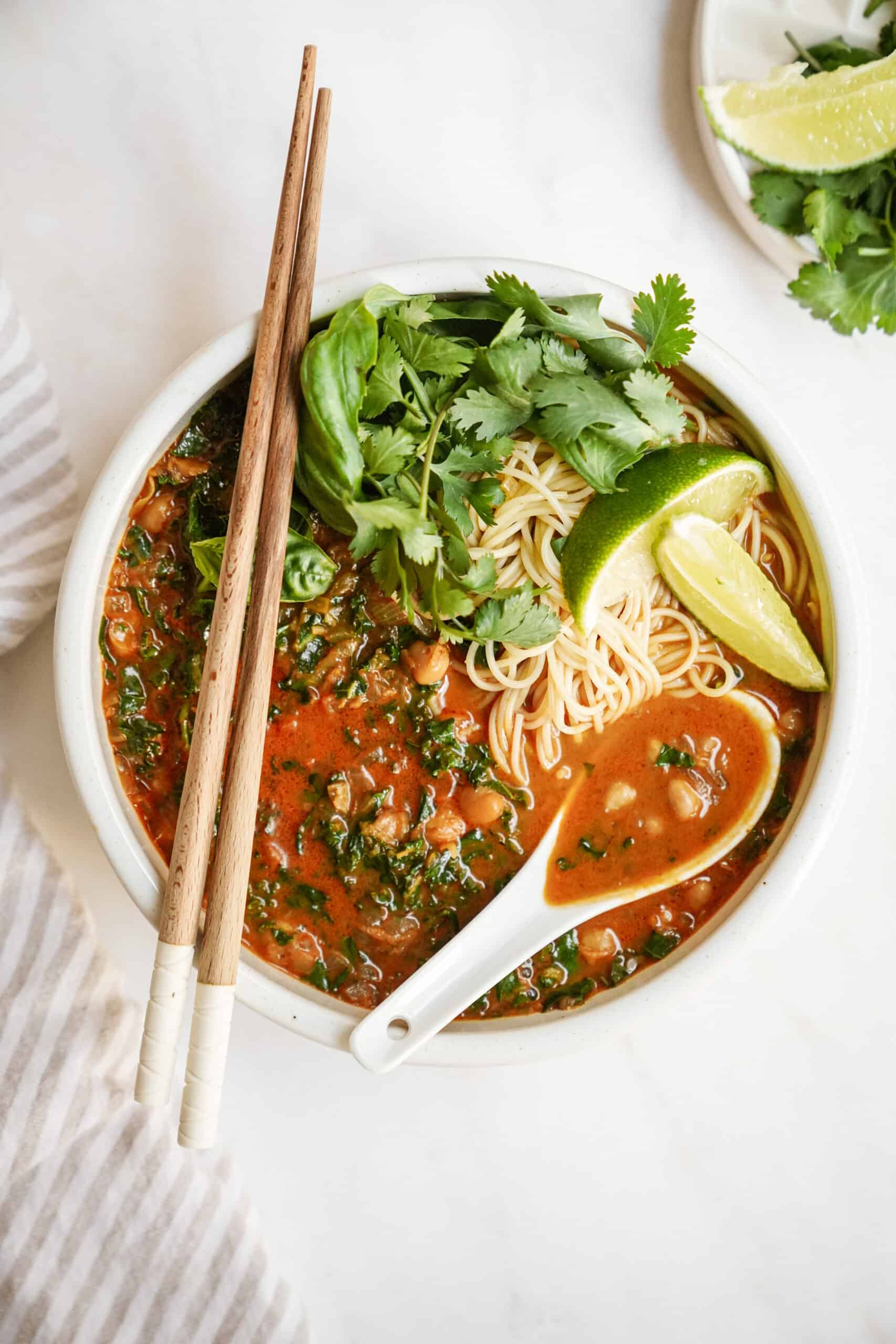 Curry noodle soup in big bowl with chopsticks