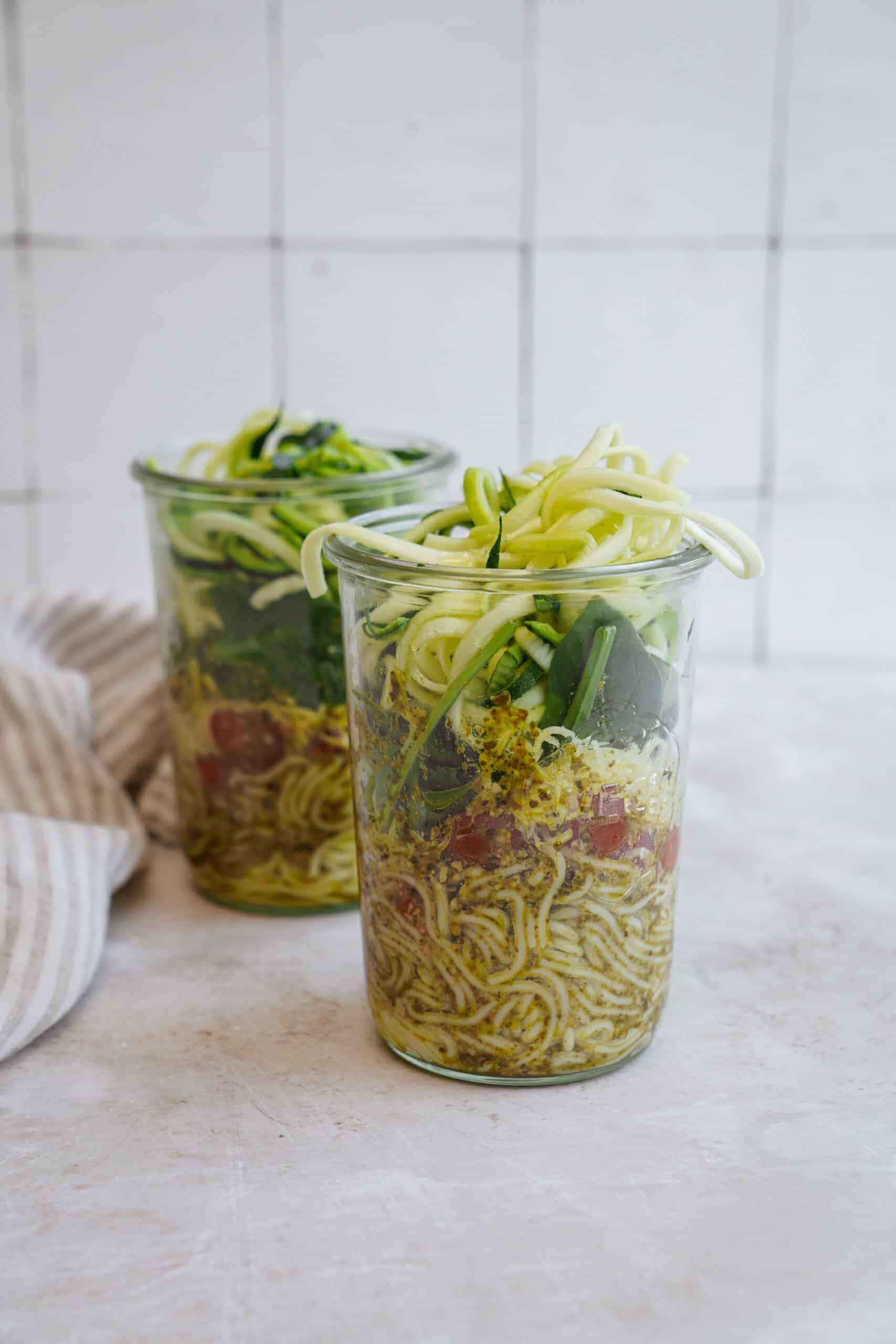 Two mason jar salads on a counter