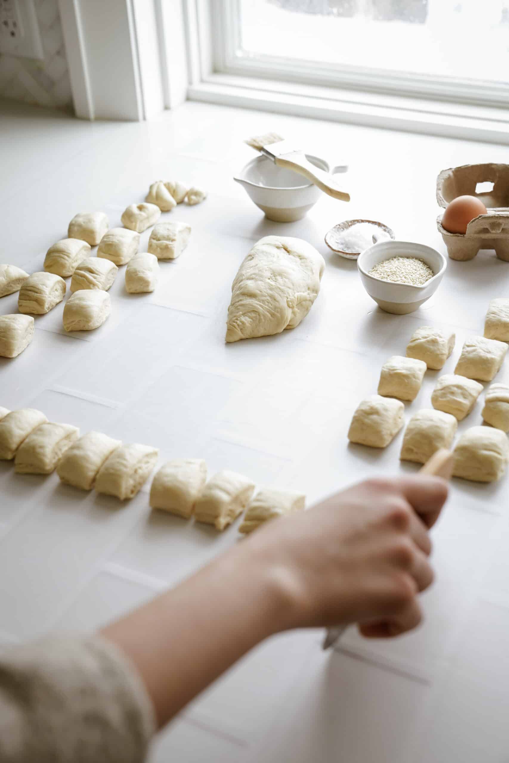 Cutting dough into pieces for pretzel bites