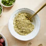 Dukkah in a bowl with a spoon