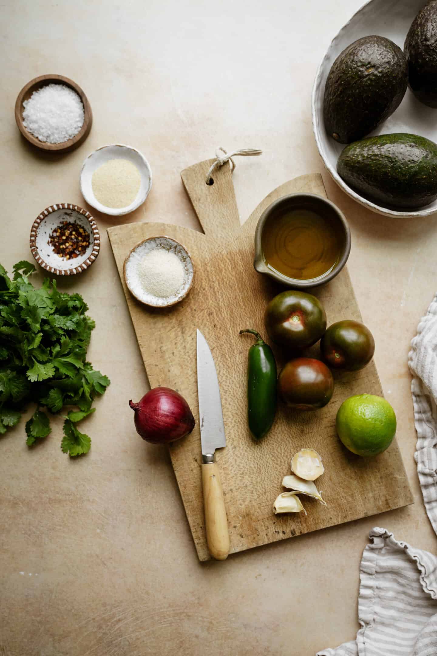 Ingredients for guacamole on a cutting board