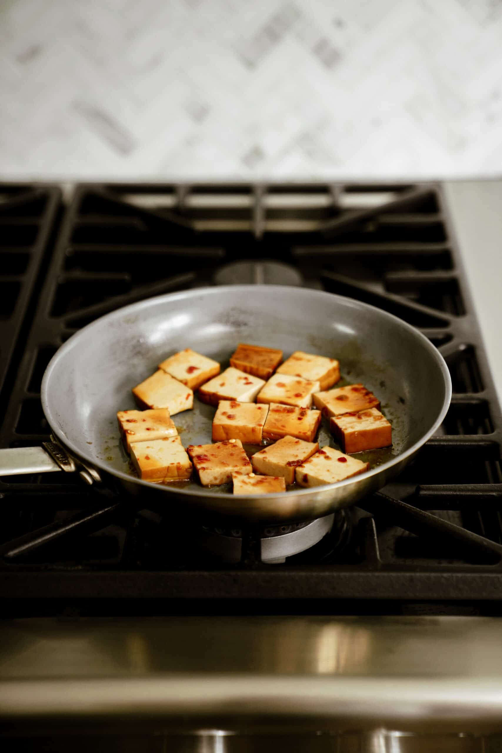 smoked tofu cooking on pan