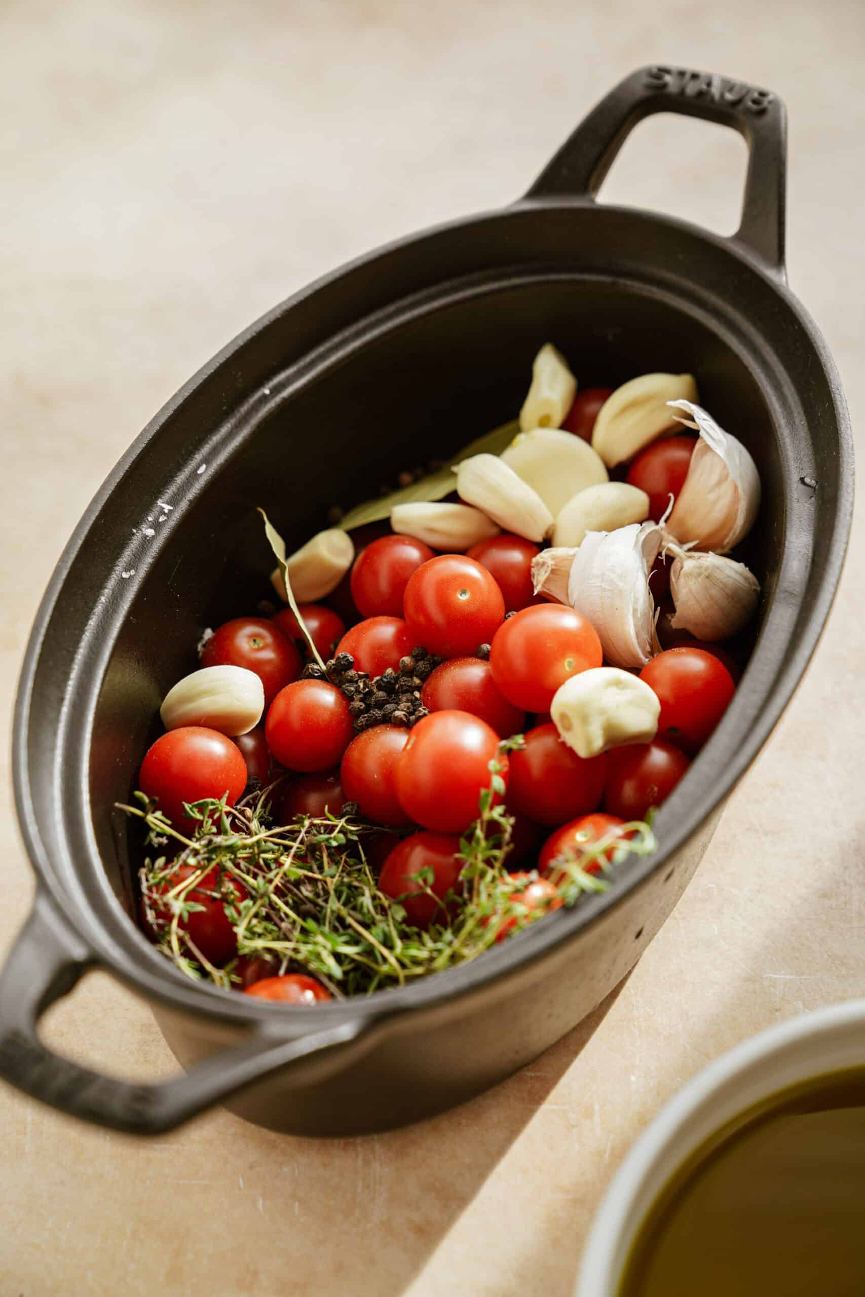 tomato confit ingredients in pan