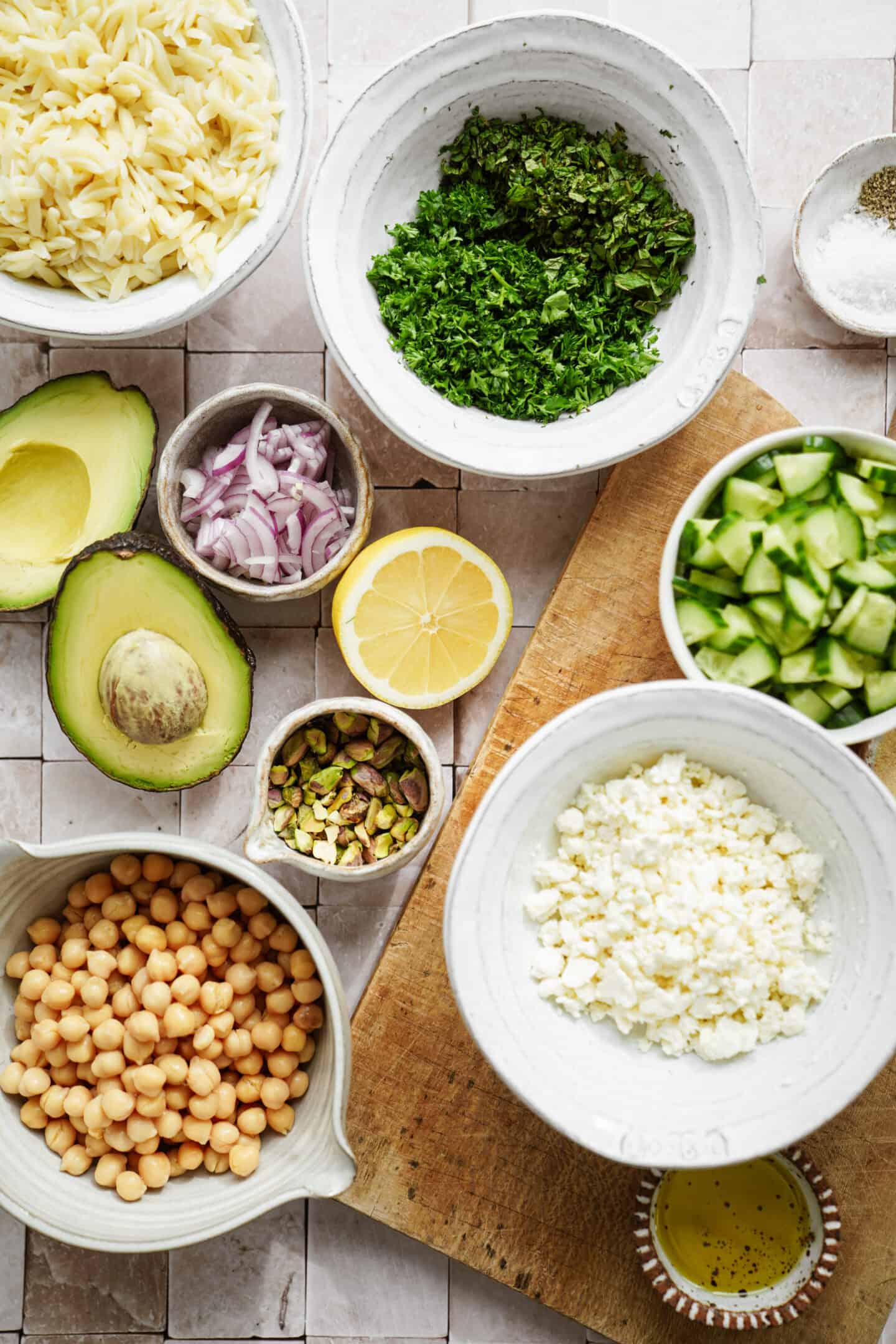 Jennifer Aniston Salad ingredients laid out on a counter and cutting board