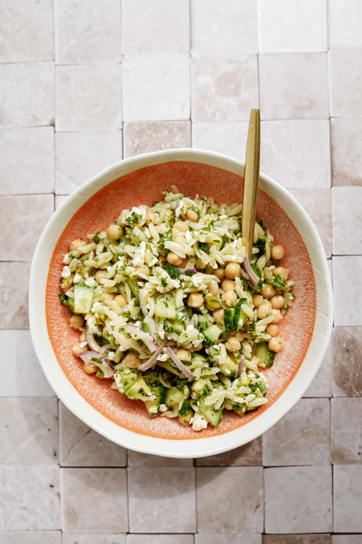 Close up of Jennifer Aniston Salad in a serving dish with a spoon