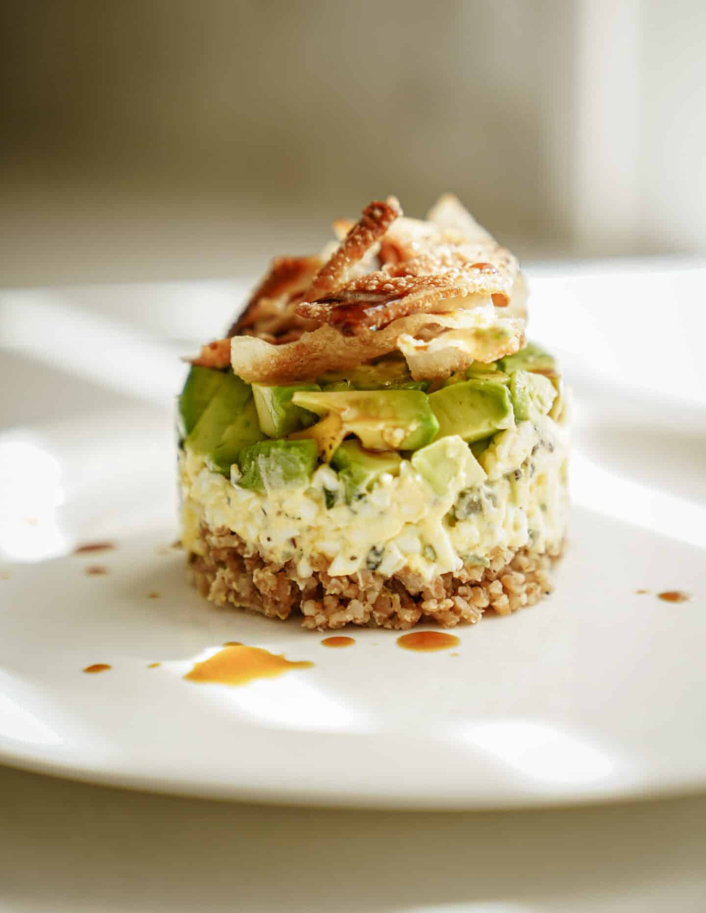 Bulgar wheat salad stack on white plate