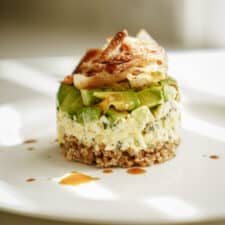 Bulgar wheat salad stack on white plate