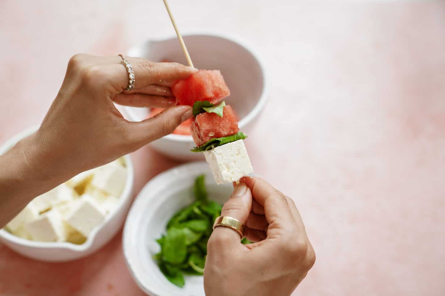 Hand assembling summer appetizers for bbq