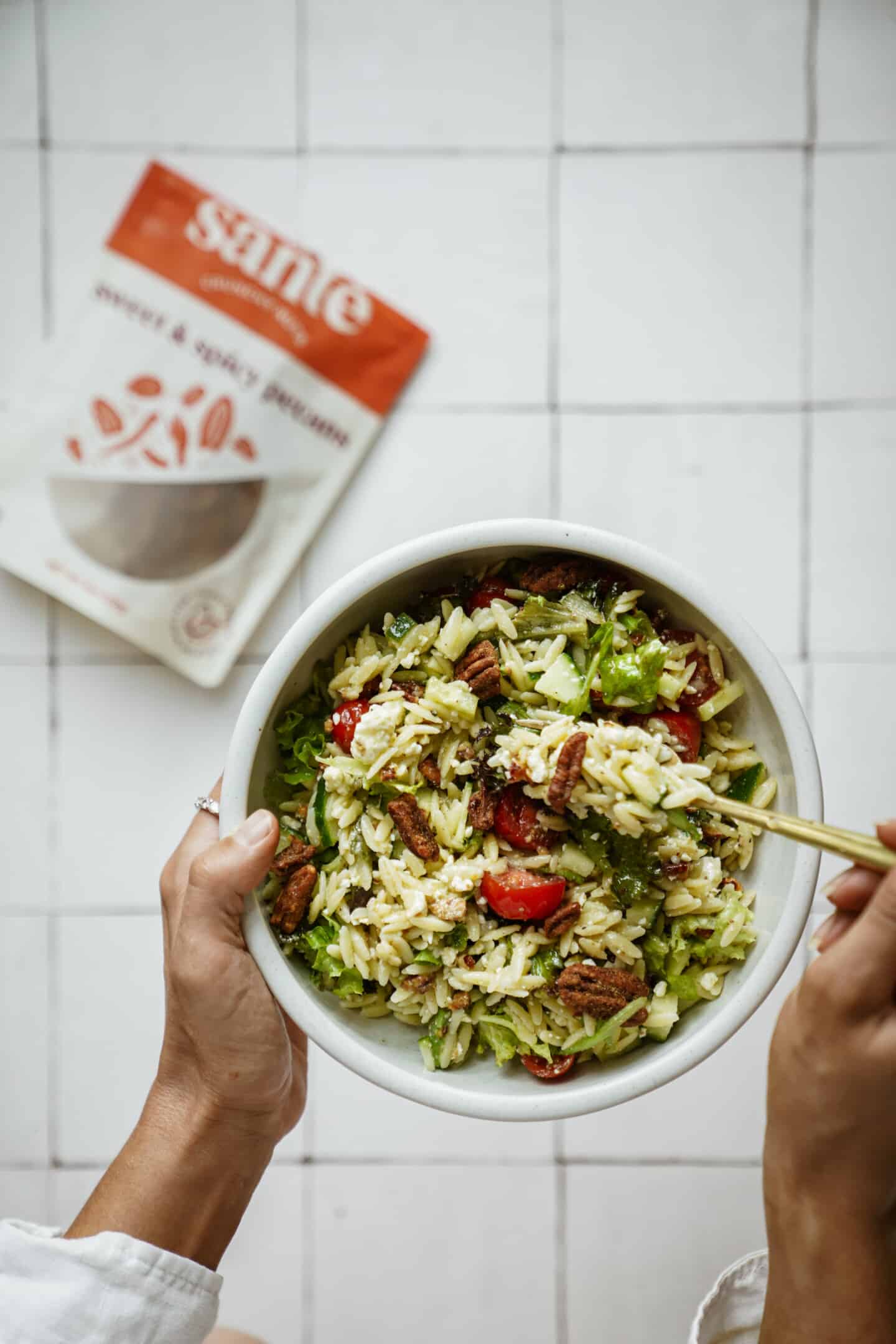 Summer salad with a spoon in it 