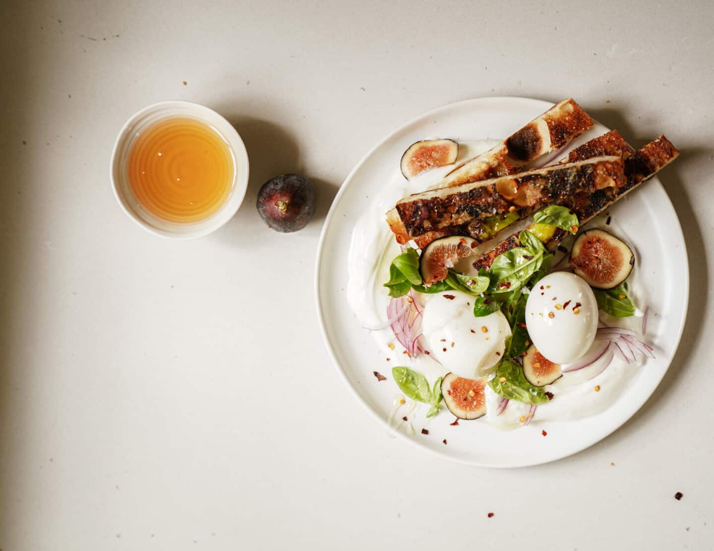 Plate of jammy eggs with a side of juice