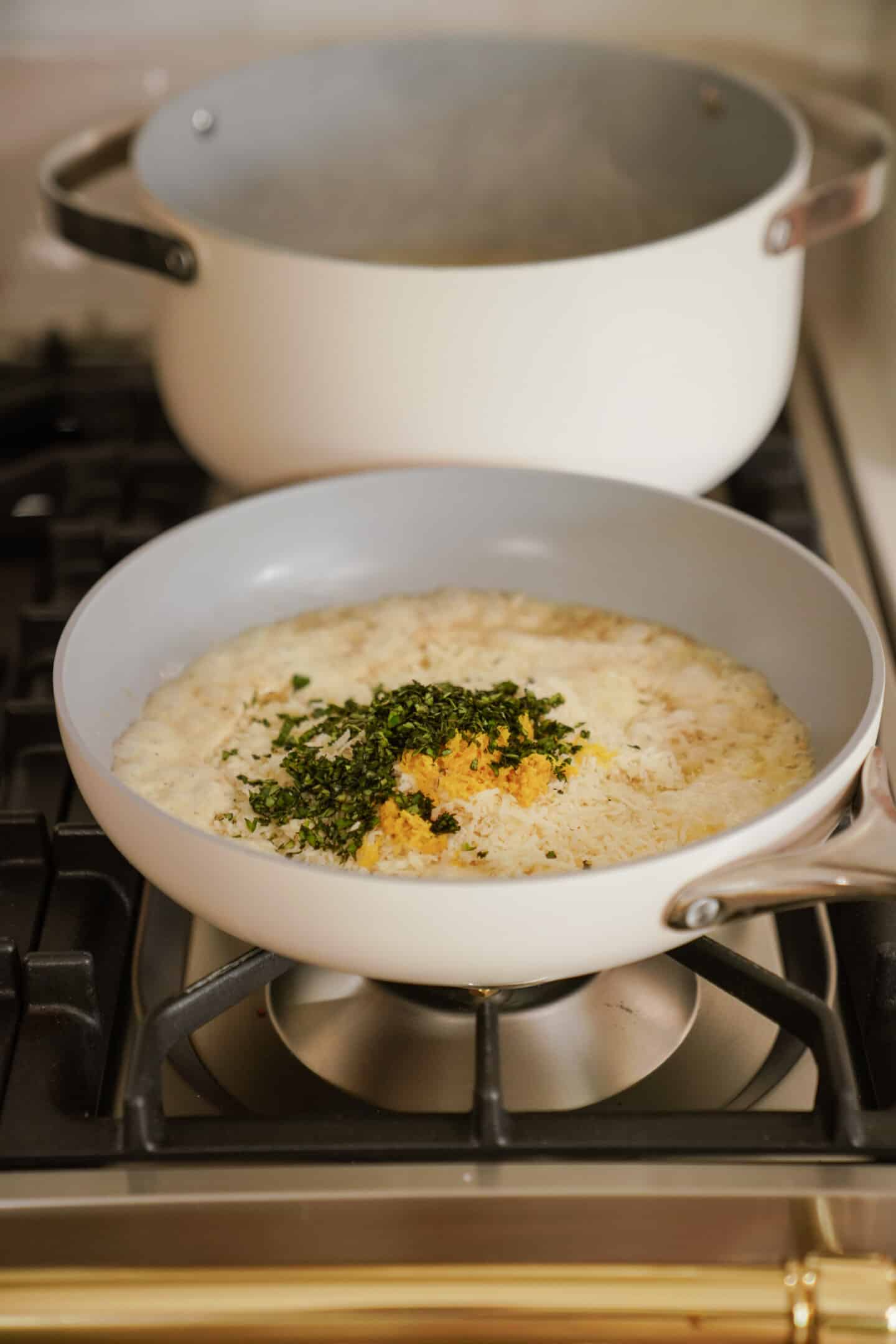 Pan with ingredients for lemon garlic pasta in it