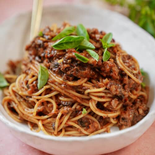 freshly cooked pasta bolognese recipe in a white bowl