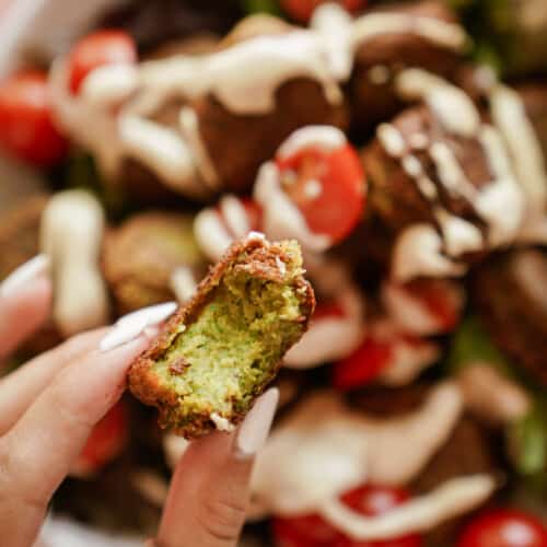 Hand holding an easy falafel