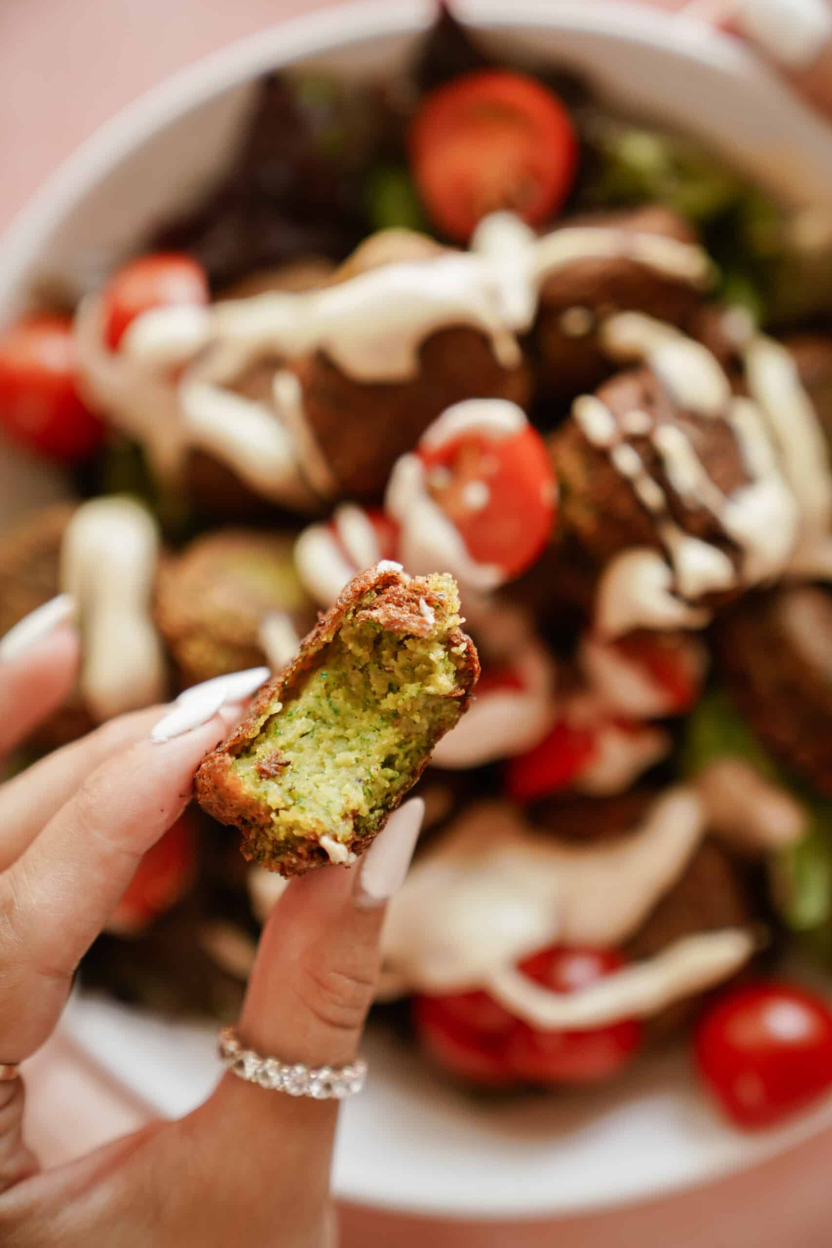 Hand holding an easy falafel