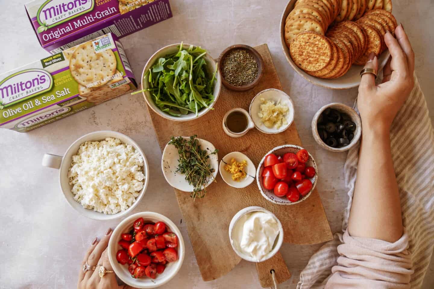 Ingredients for baked feta dip on counter