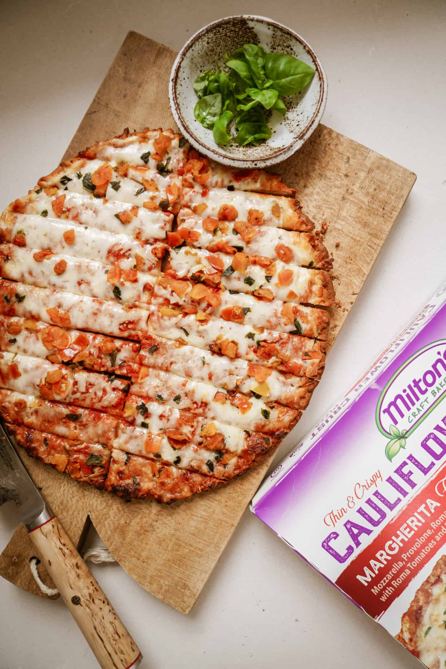 Pizza cut into sticks for cream cheese dip