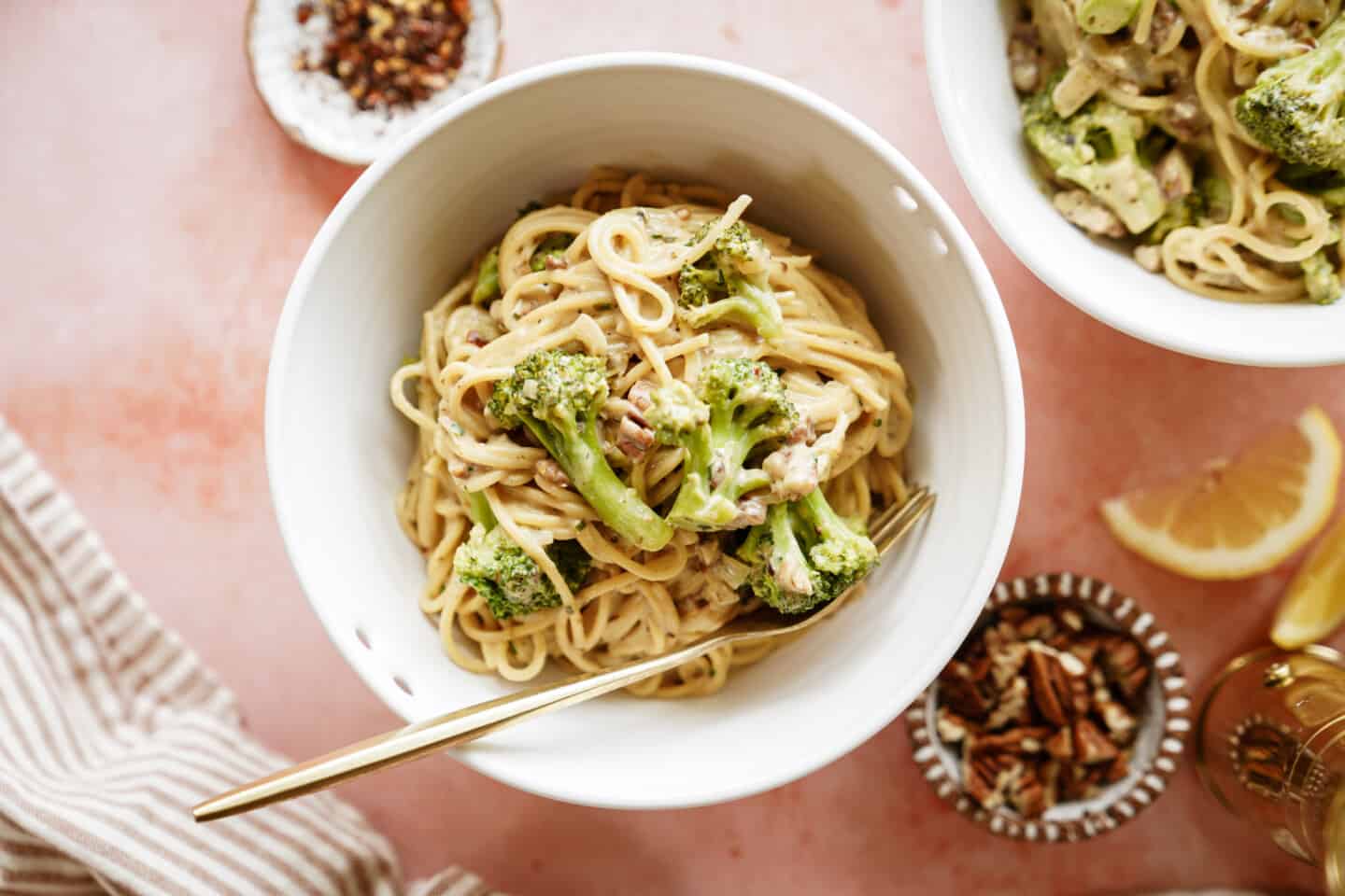 White bowl of creamy broccoli pasta