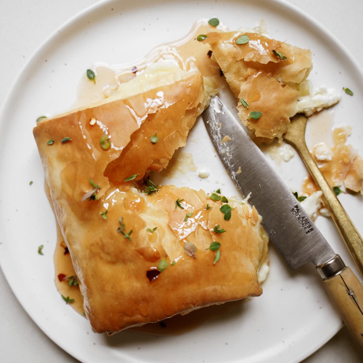 Tiropita on a plate with a knife