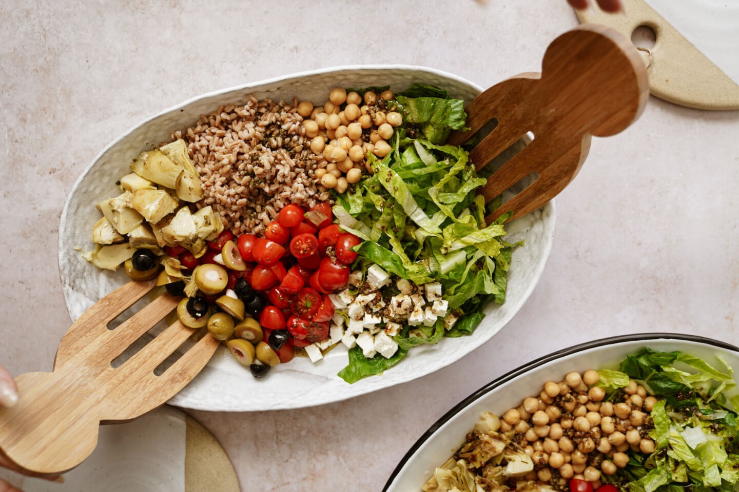 Grain bowl with serving spoons in it