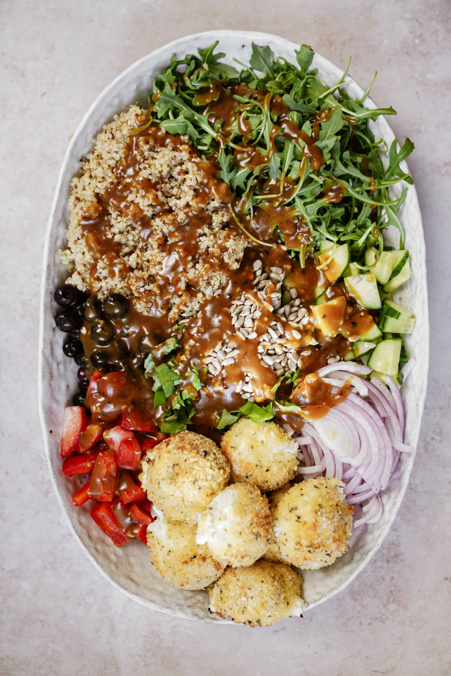 Goat cheese balls in a serving dish