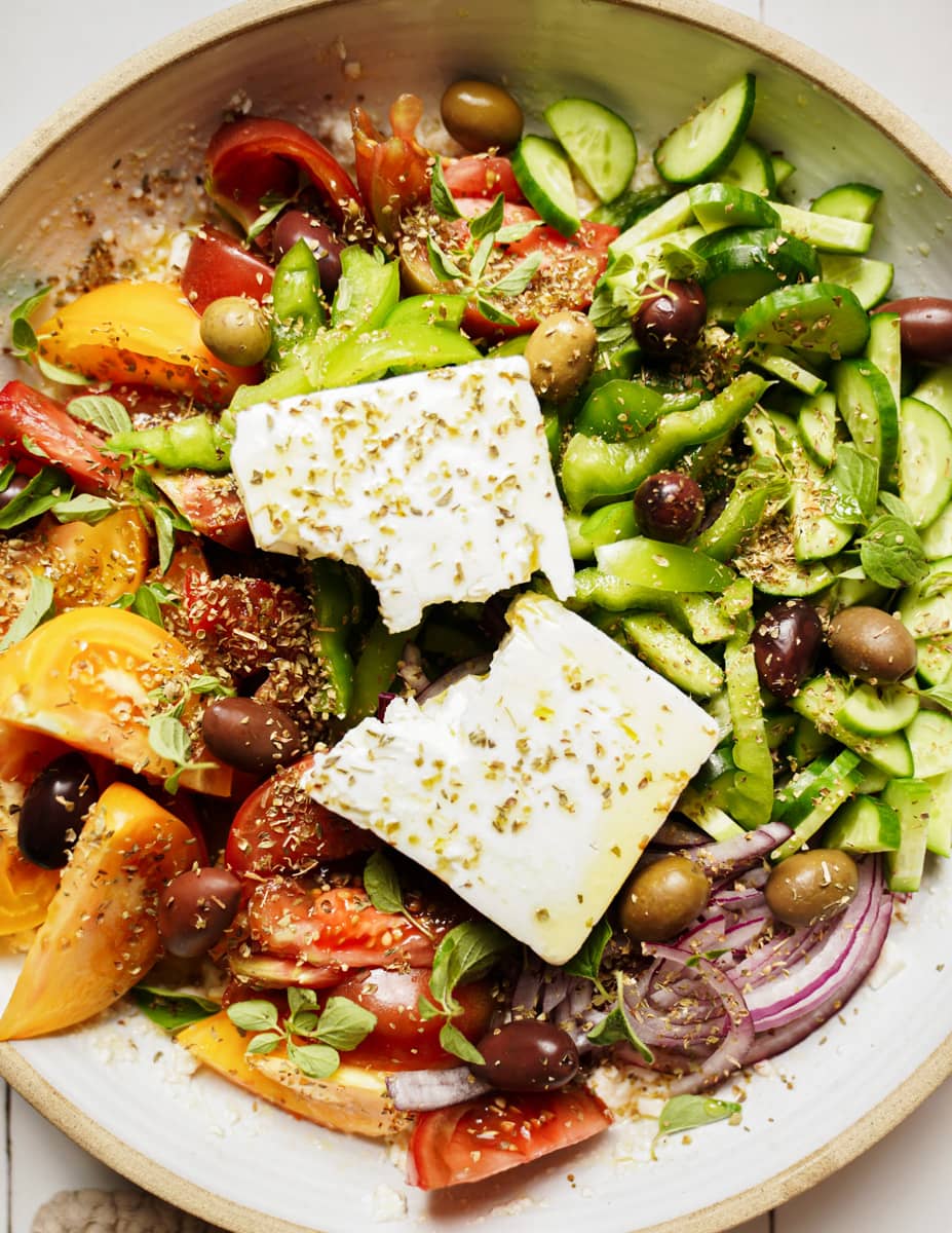 Greek salad with a big piece of feta on top