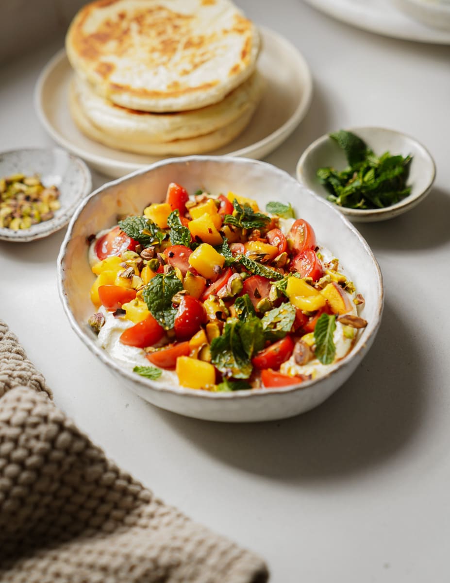 Whipped feta recipe in a white serving dish on a table